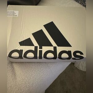 Brand new Addidas white with pink on back woman’s sneakers